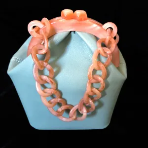 A DUCK EGG VINYL AND LUCITE BAG