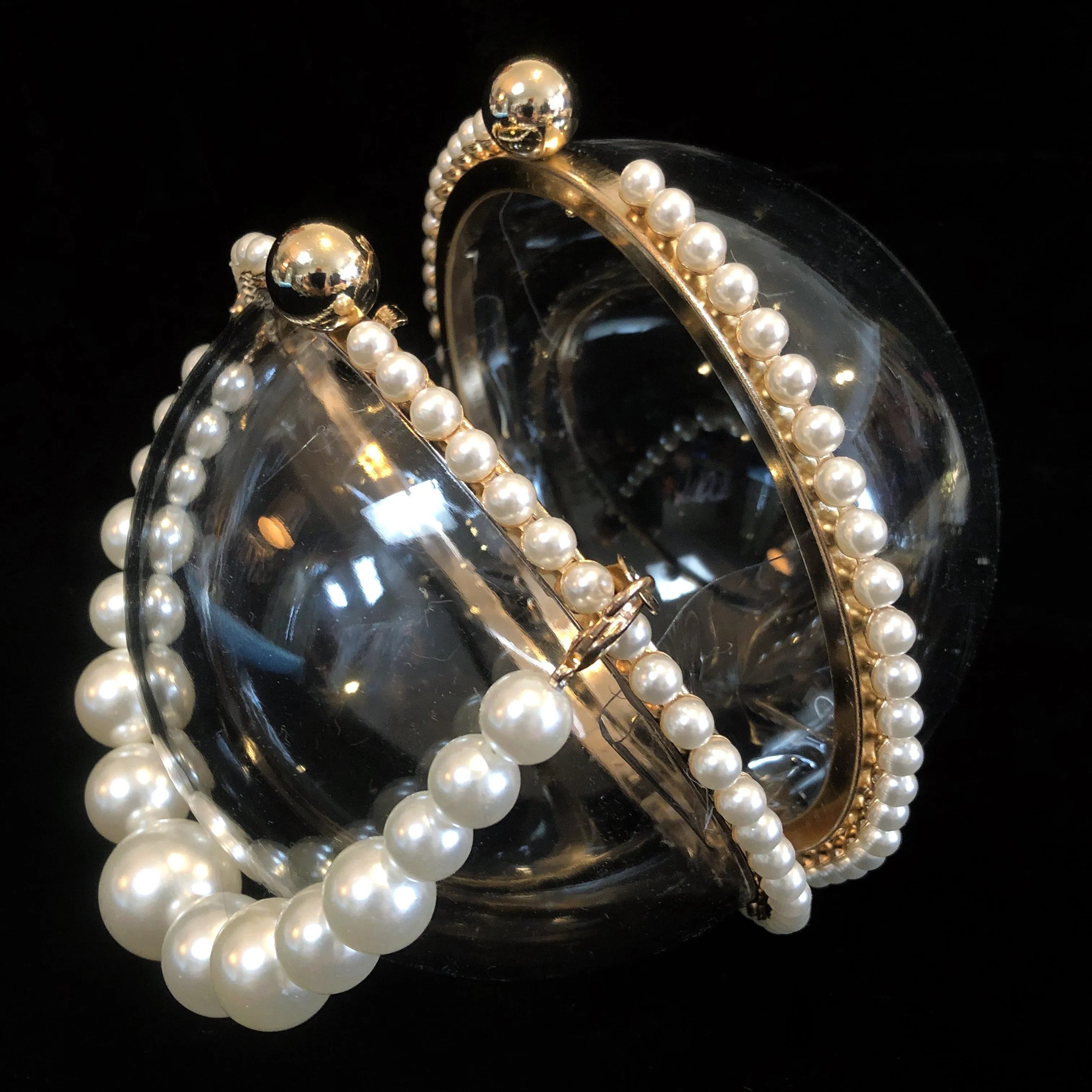 A PERSPEX SPHERICAL EVENING BAG WITH PEARLS